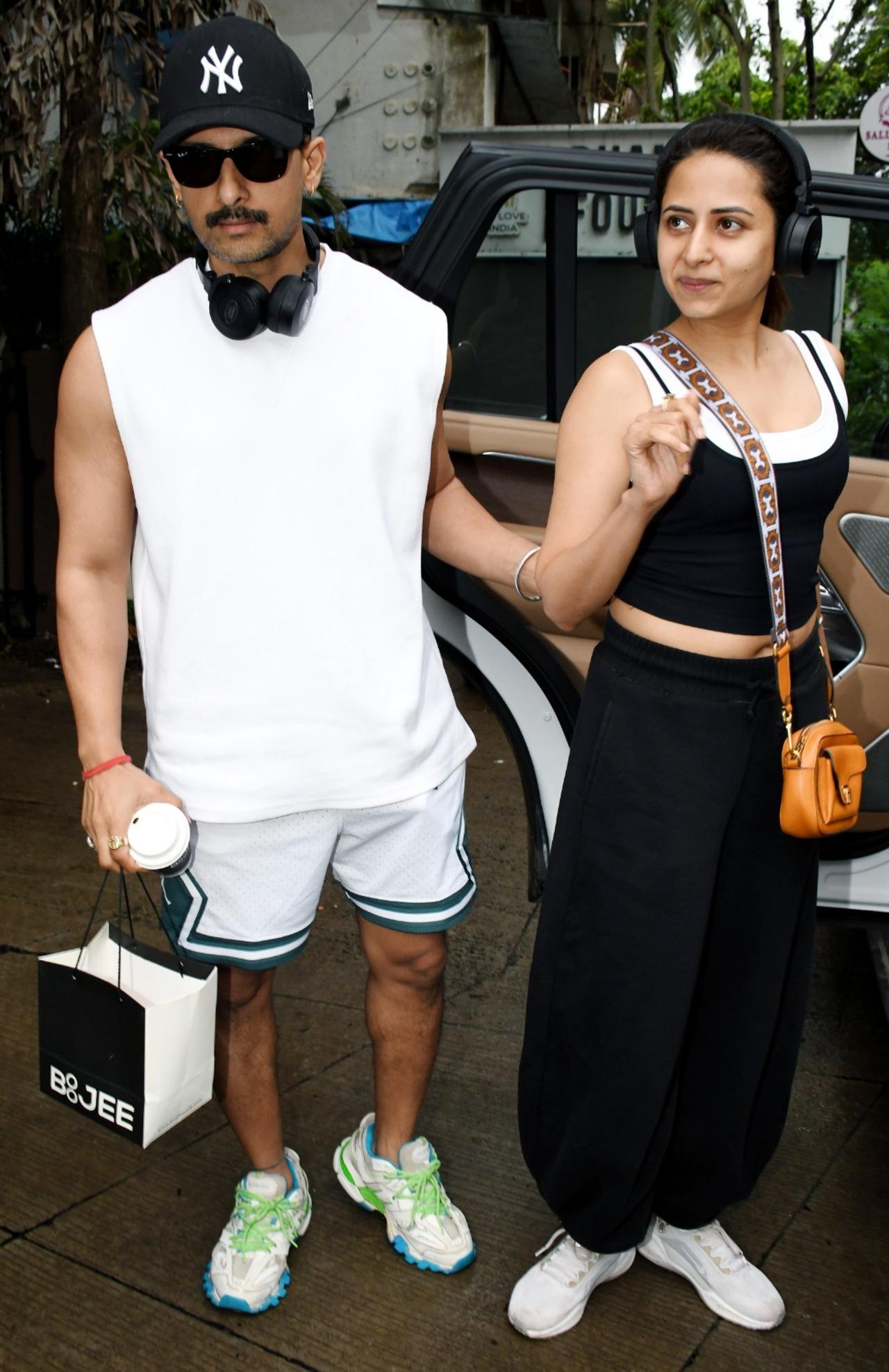 Ravi Dubey and Sargun Mehta were clicked after a workout session in coordinated athleisure outfits. Ravi Dubey and Sargun Mehta were clicked after a workout session in coordinated athleisure outfits.
